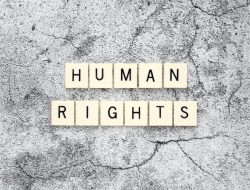 Human Rights word tiles on a cracked concrete background